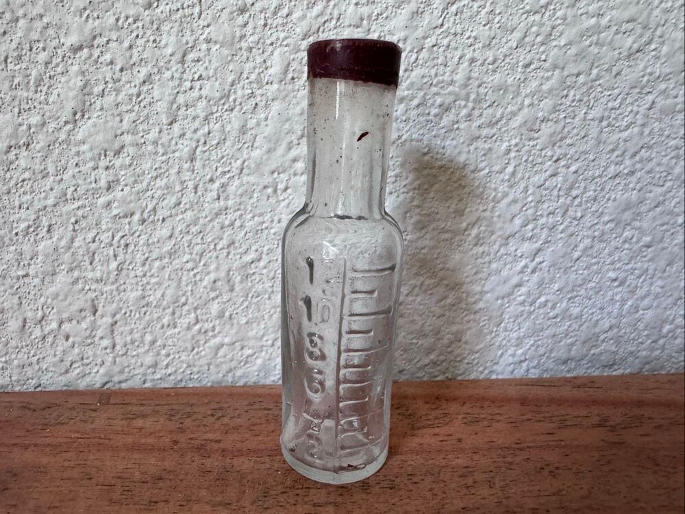 Vintage glass apothecary medicine bottle clear molded raised numerical mid 19th